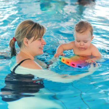 A woman and baby in the pool